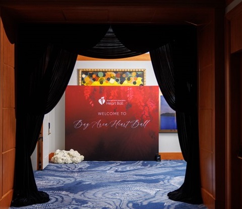 Welcome to Bay Area Heart Ball entrance with curtains around doorframe.